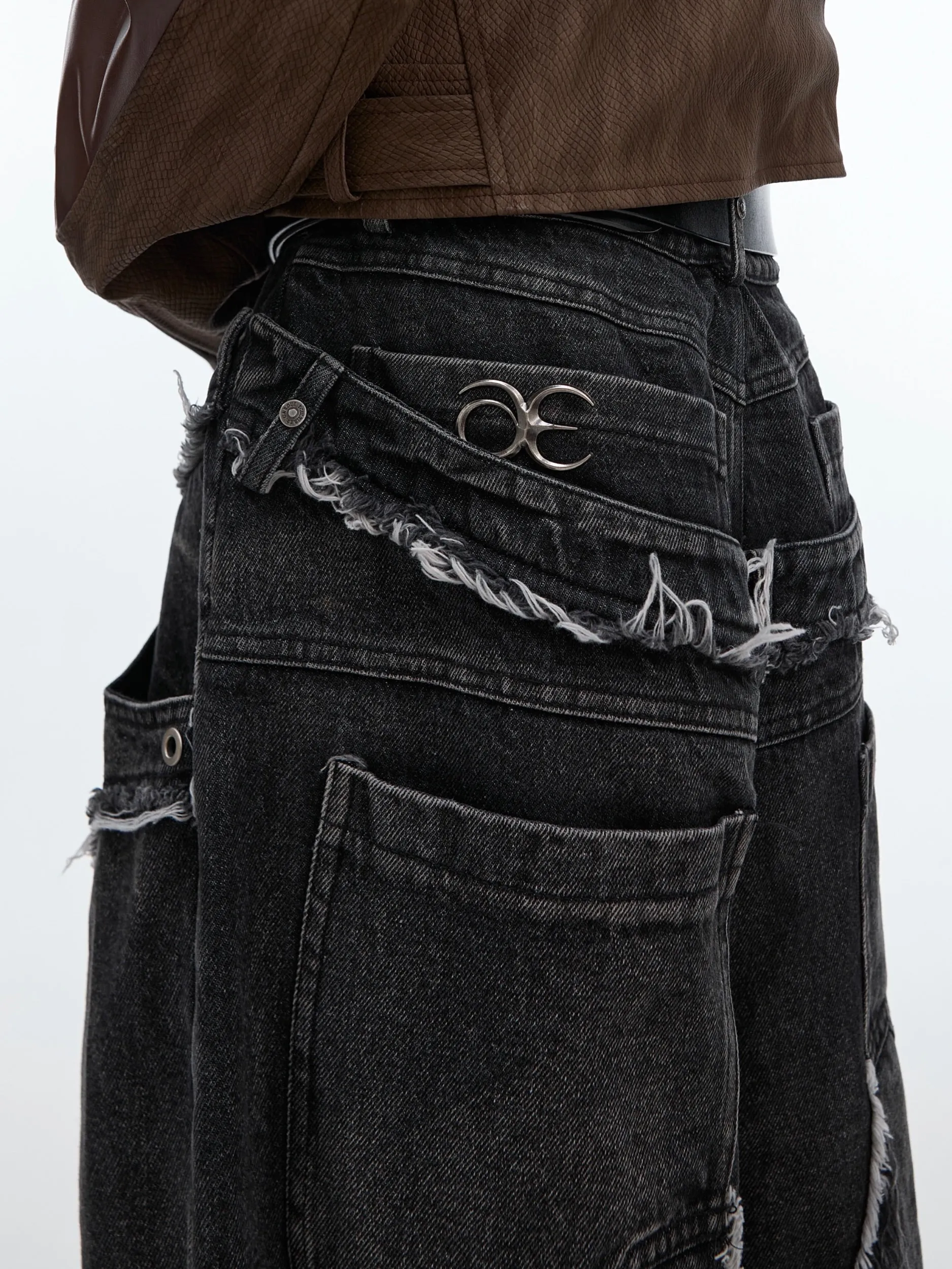 Distressed Paneled Jeans with Raw Edges and Washed Finish