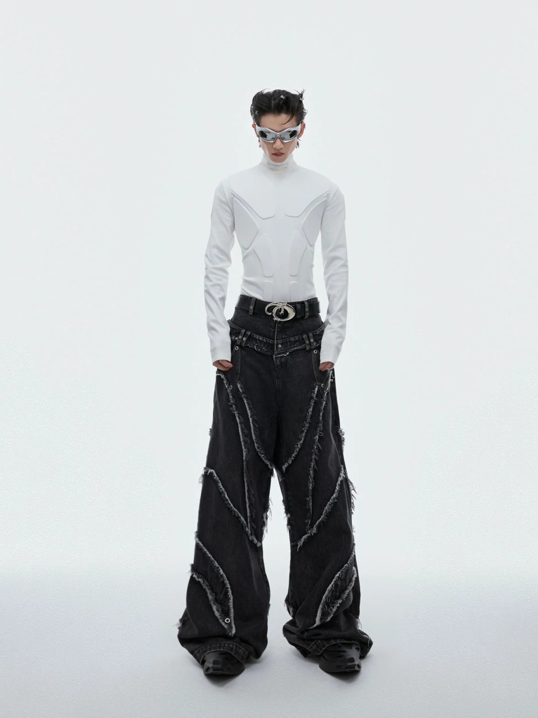 Distressed Paneled Jeans with Raw Edges and Washed Finish