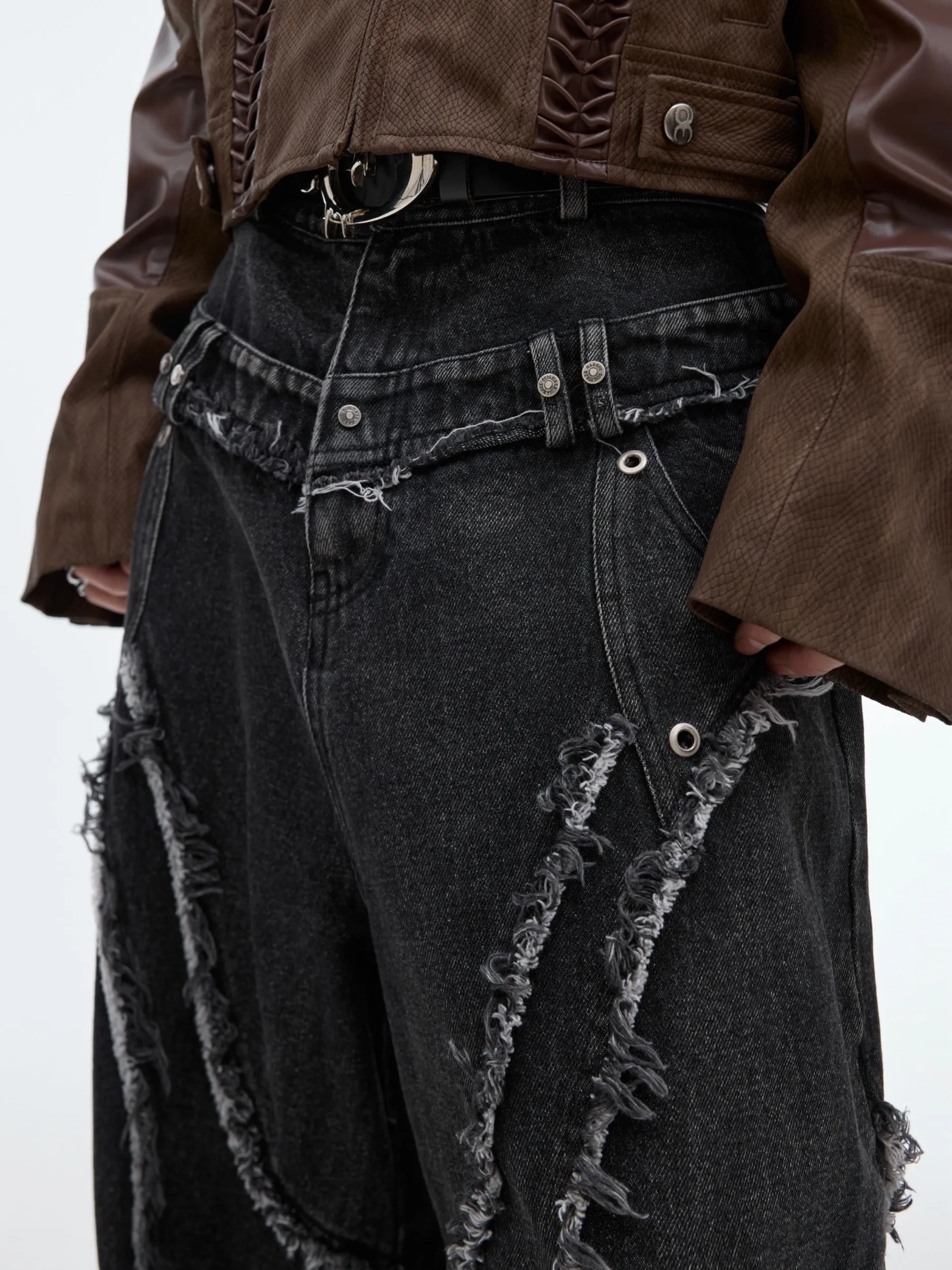 Distressed Paneled Jeans with Raw Edges and Washed Finish
